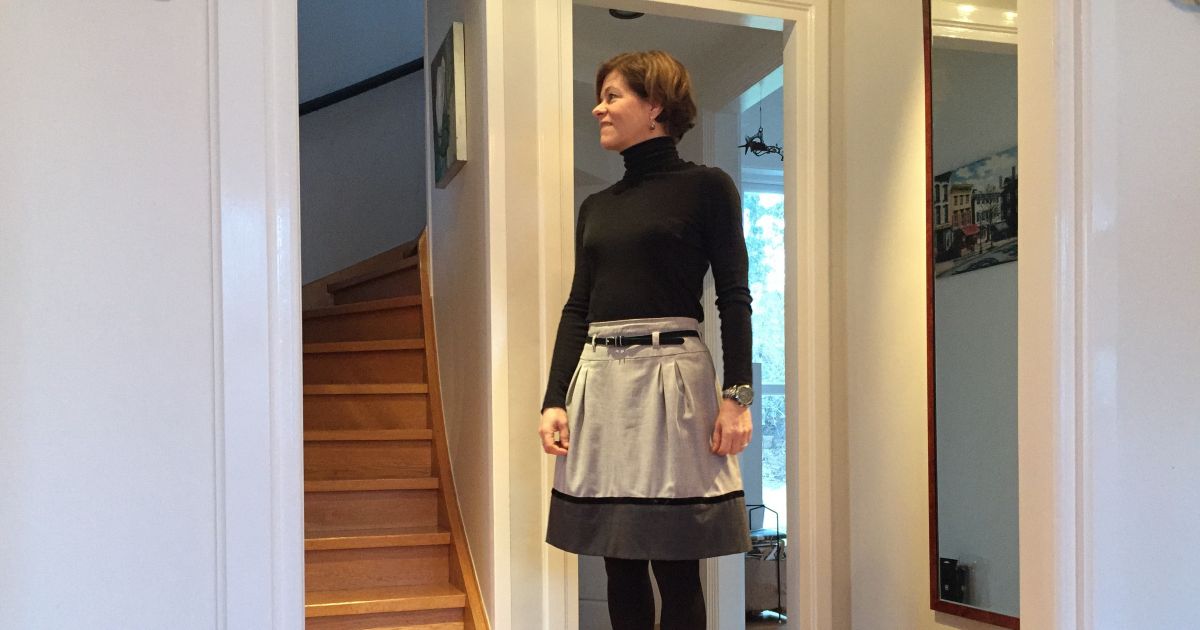 black turtleneck and skirt